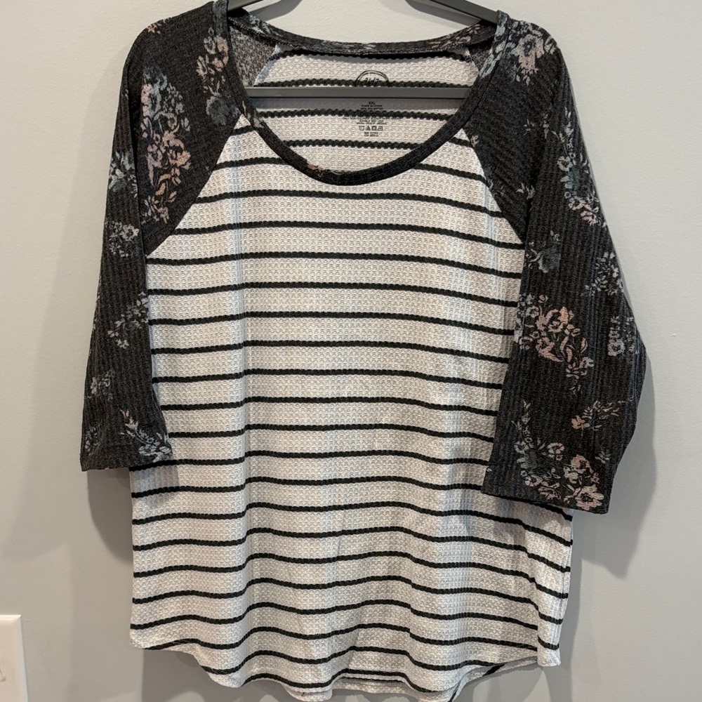 Elegant Black and White Striped Top with Floral Sleeves